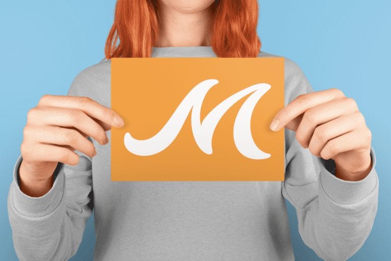 horizontal-post-card-mockup-being-held-by-a-woman-a20559