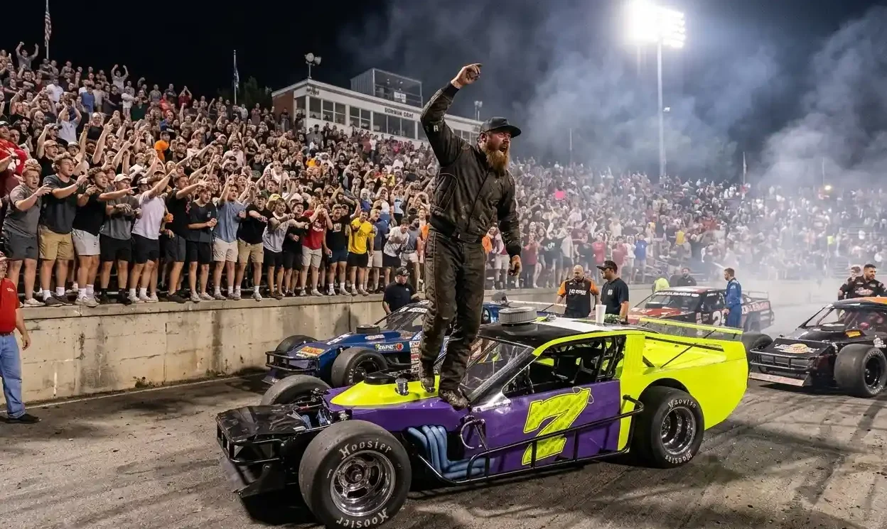 Zack Staley standing on car at Bowman Gray Stadium