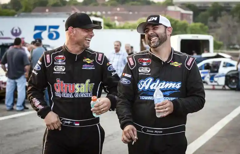 Burt Myers walking through pit area at Bowman Gray Stadium