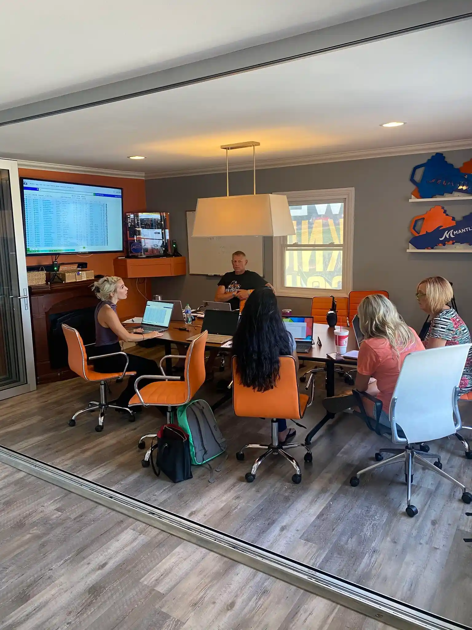 Mantle Realty agents meeting in the office conference room
