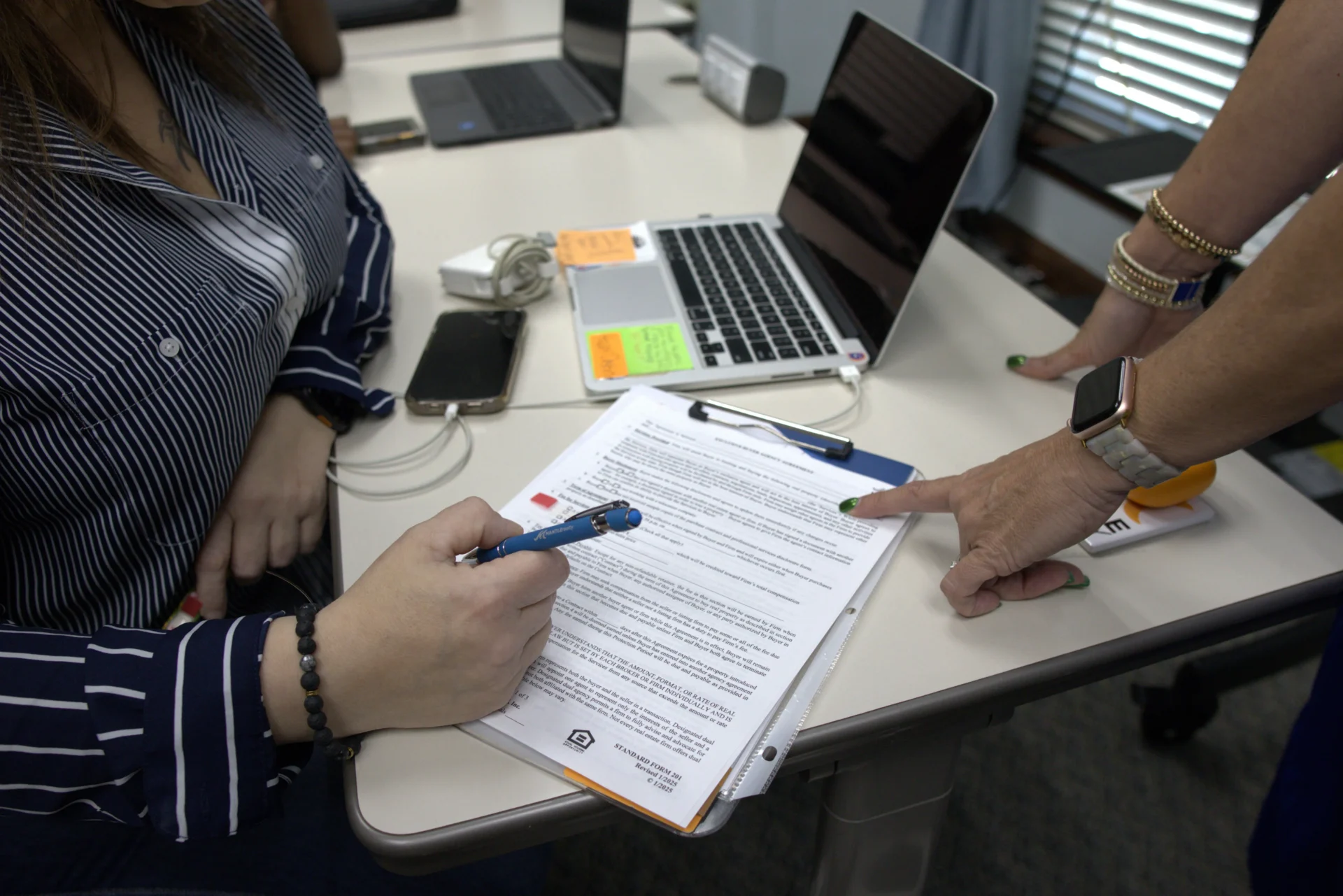 Mantle Realty agents working through contract and paperwork training