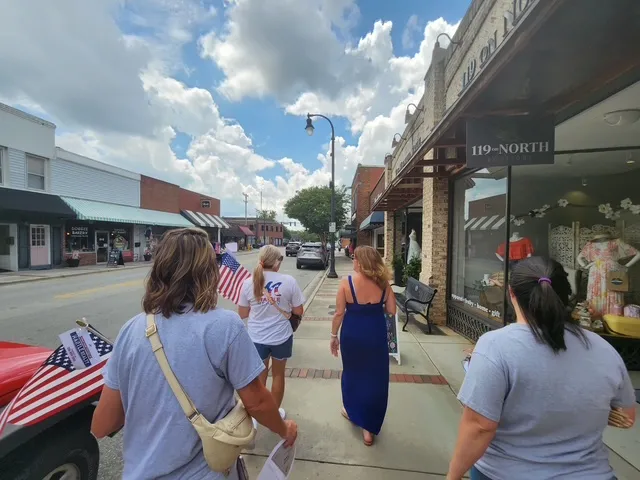 Mantle Realty giving out flags to local businesses in Kernersville