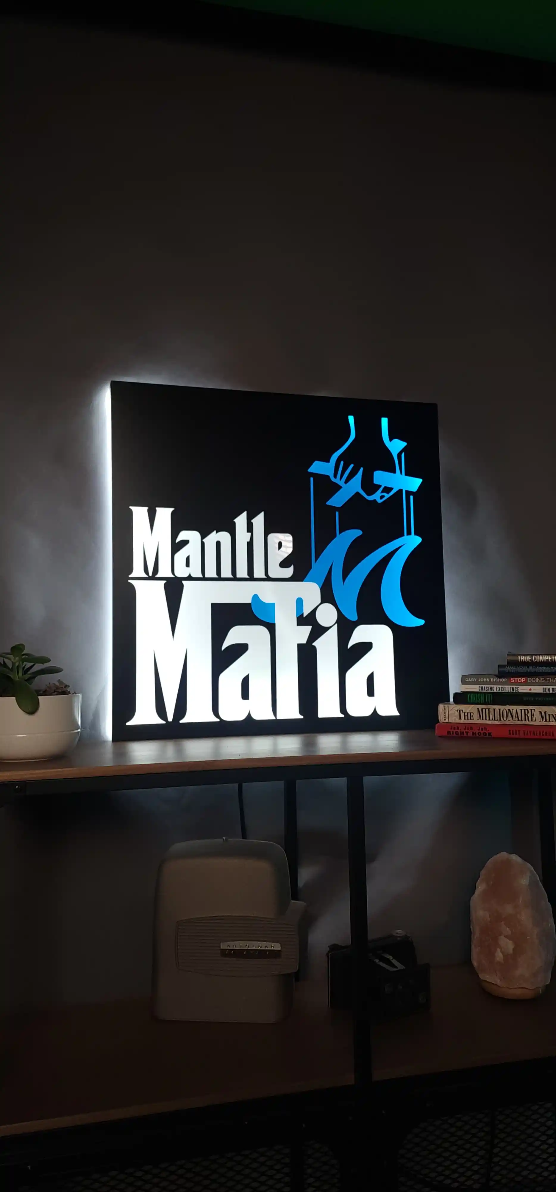Mantle Mafia sign inside the Mantle Realty office representing support for agents and clients