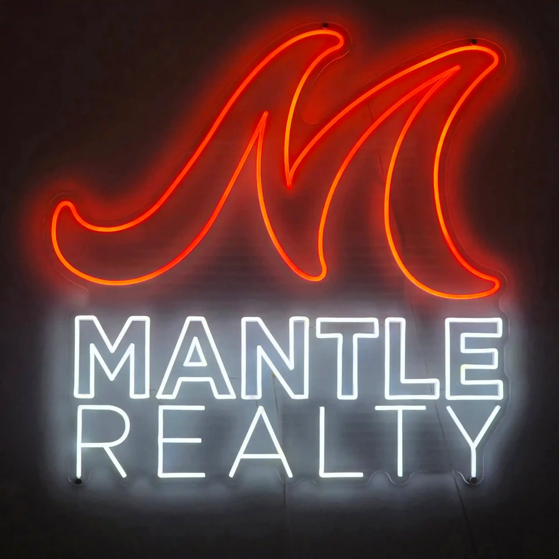 Mantle Realty neon sign inside one of the Triad NC offices
