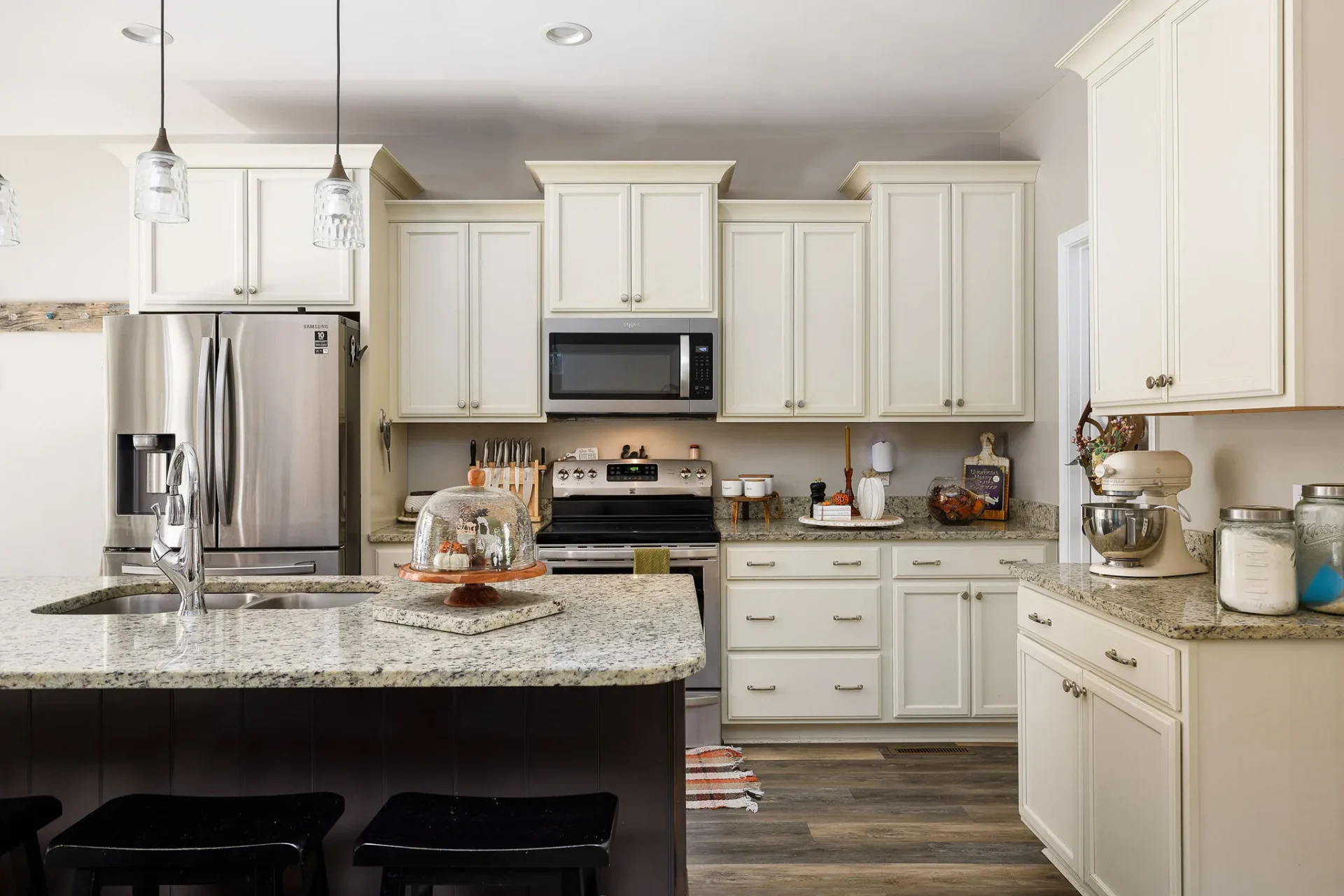 Bright professionally photographed kitchen in a Triad NC home with clean countertops and natural light