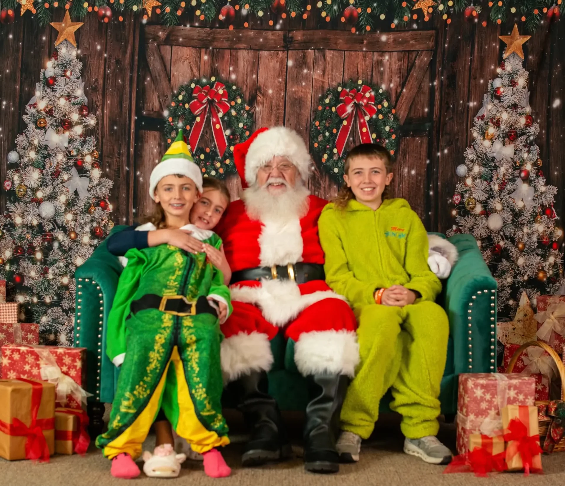 Kids taking photos with Santa at Pancakes and Pajamas