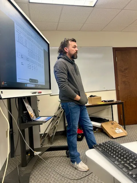 Dustin instructing agents during Tuesday morning training at Mantle Realty