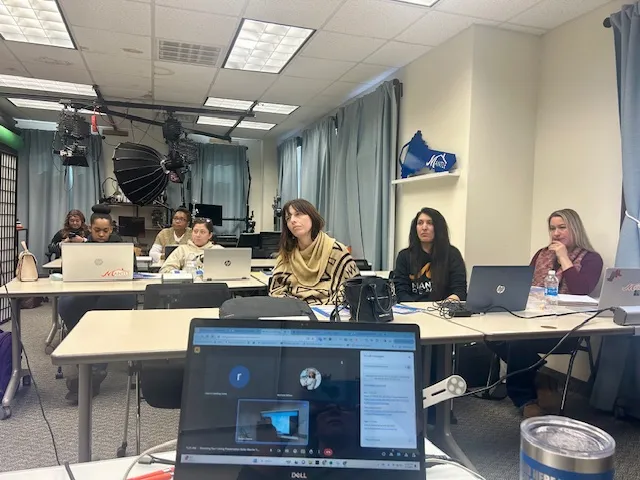 Mantle Realty agents listening during Tuesday morning training at the High Point office