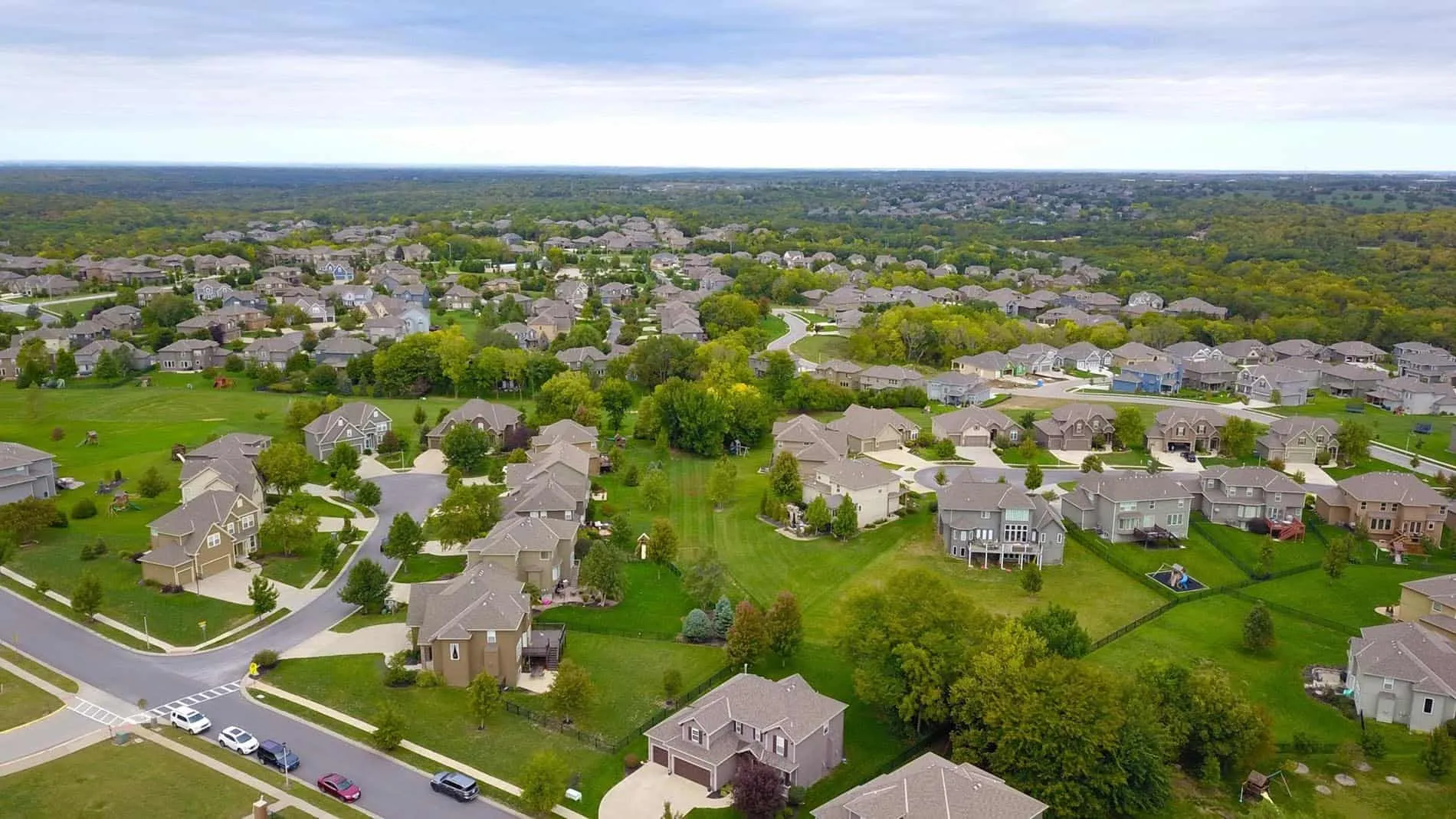 Aerial photography of gray houses showing neighborhood context and layout