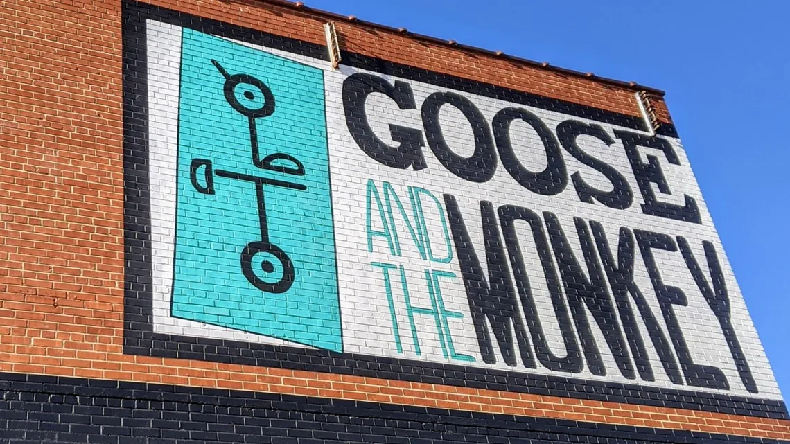 Goose and the Monkey sign in Lexington