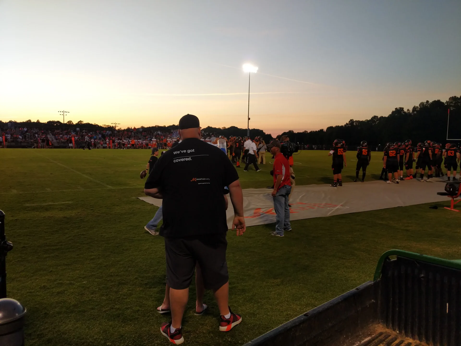 Mantle Realty agents at a North Davidson football game giving away shirts