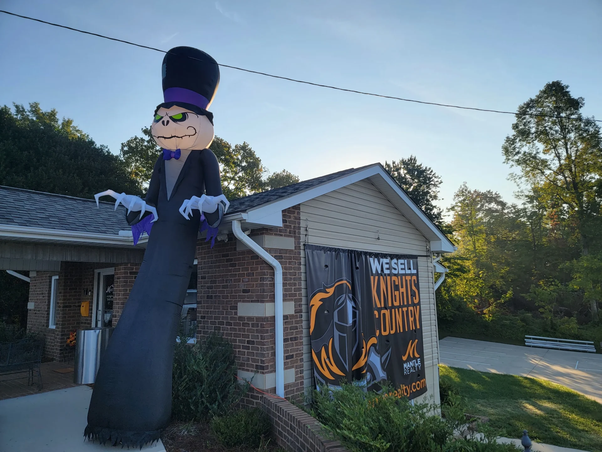 mantle realty welcome at halloween scaled