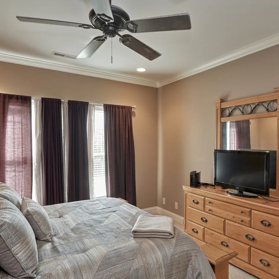 Bright professionally photographed bedroom in a Triad NC home with clean staging and balanced lighting